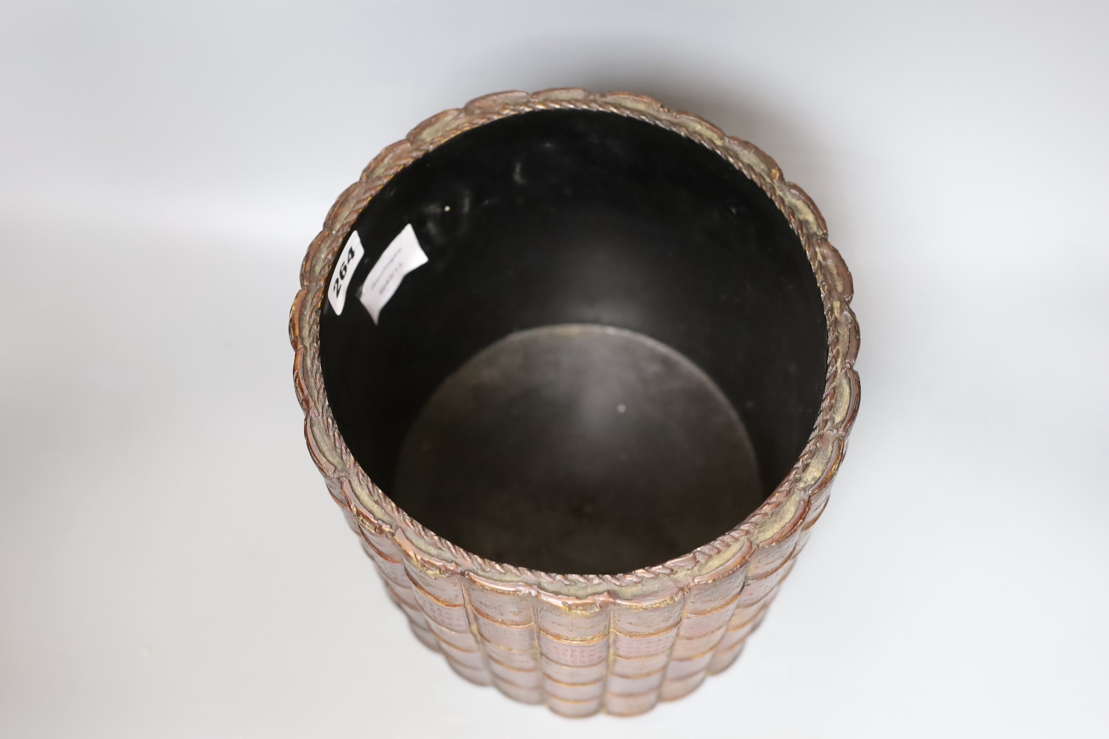 A ‘Royal Academy Pictures’ faux book spine waste paper bin, 22cm diameter.